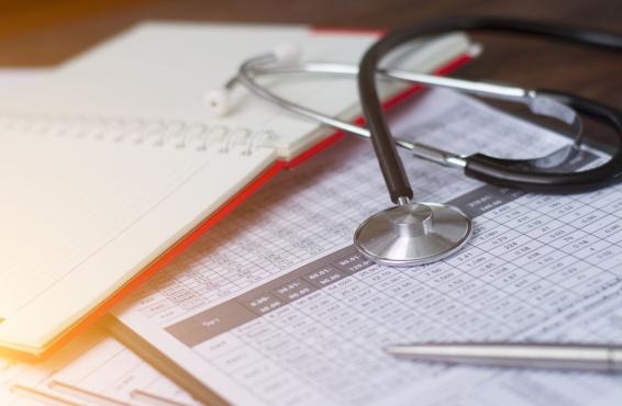 Stethoscope on top of paperwork