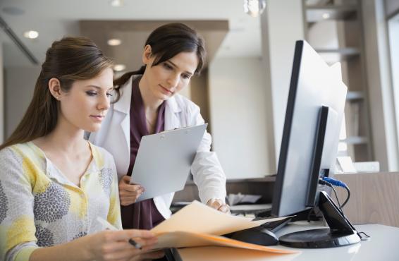 Medical professional explains information to woman