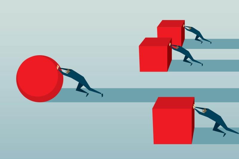 Illustration of figures pushing blocks