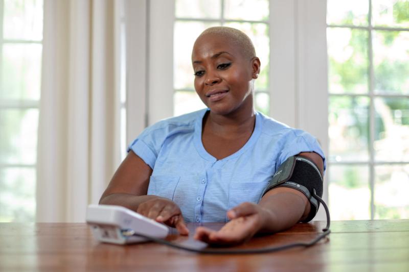 Person monitoring blood pressure