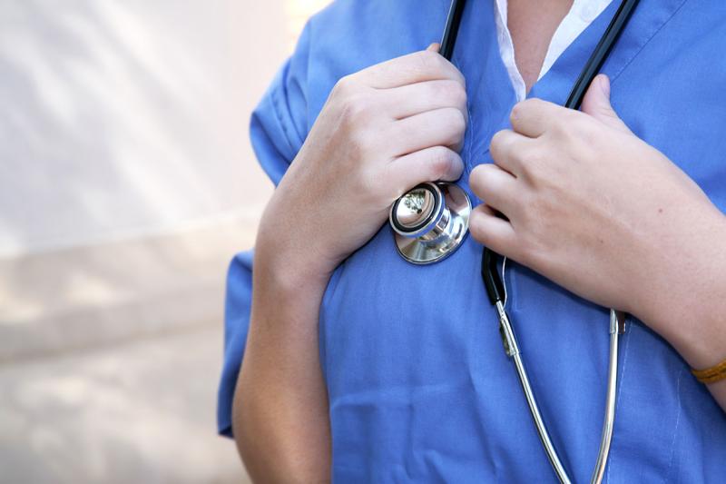 Closeup of doctor holding stethoscope