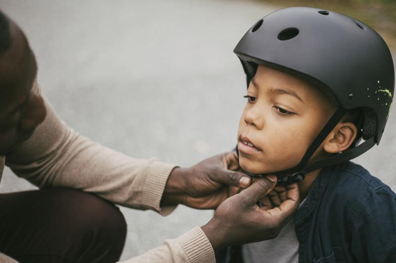 Child is fitted with a helmet